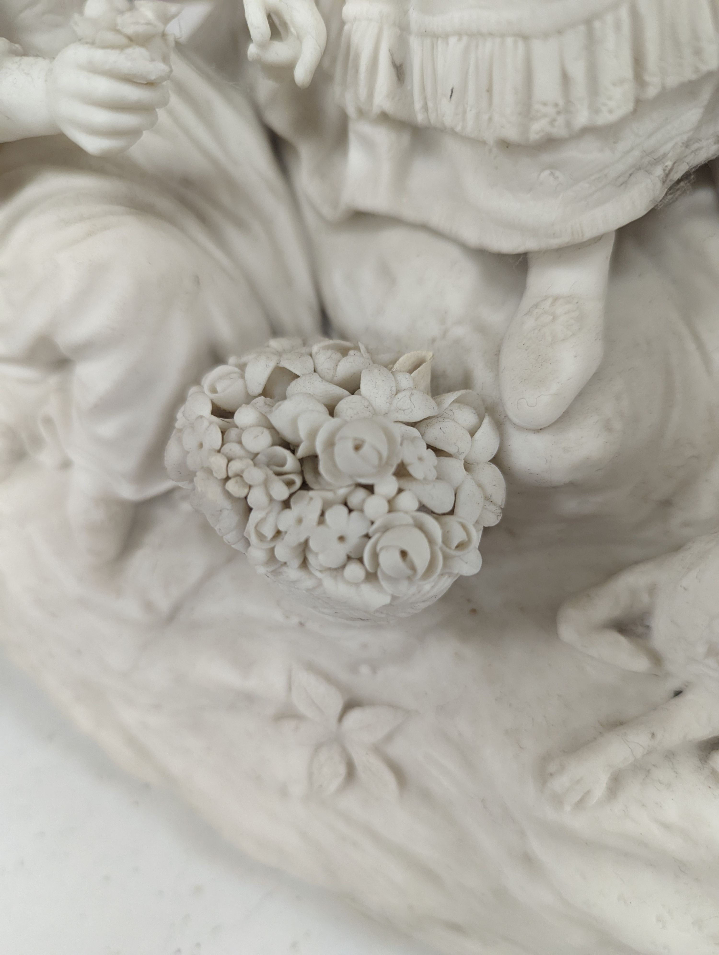 A 19th century Adams & Co. parian group of a man, woman, child and dog 31cm